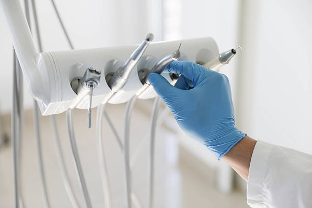 Professional Tooth Extraction technician working in Erie, IL